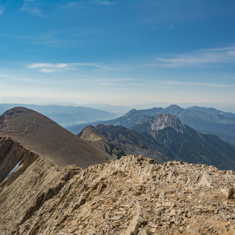 Photo of the Bridger Mountain range in Montana. Taken from the top of the ridge, showing the spiny ridge of the range snaking south.