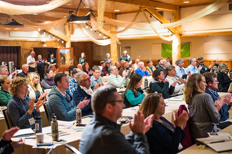 Audience members react to a speaker at the Building for Wildfire Summit.