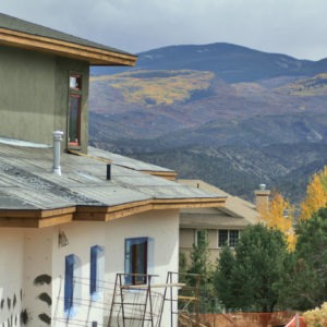 Mountain home being constructed in Autumn
