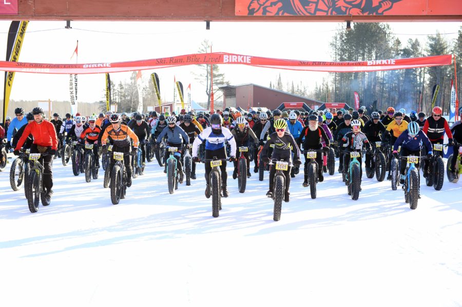 Bicyclists at the start line of the American Birkebeiner fat bike race.