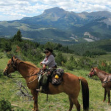 riding horses on the rocky mountain front