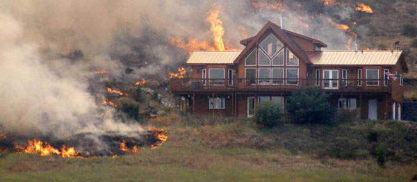 wildfire threatening home